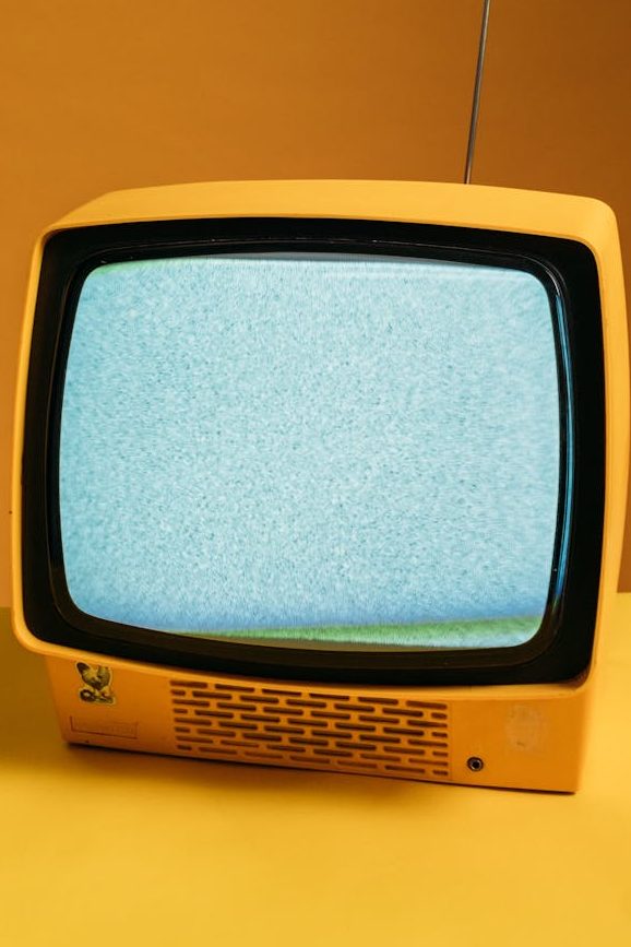 classic yellow tv with blank screen